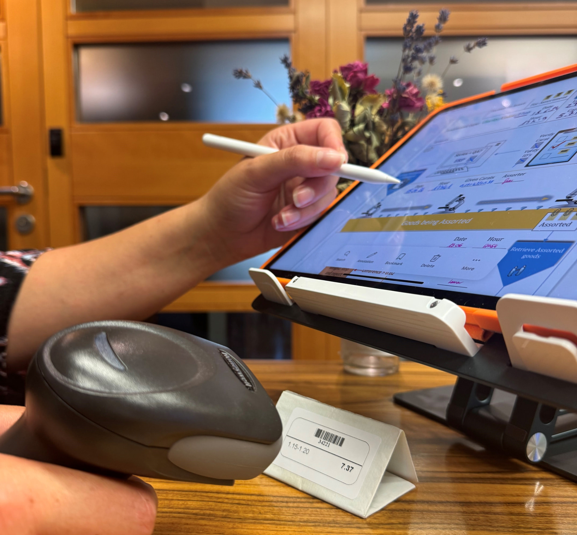 Richold assorter recording diamond parcel data — barcode scanner and digital traceability workflow on a tablet